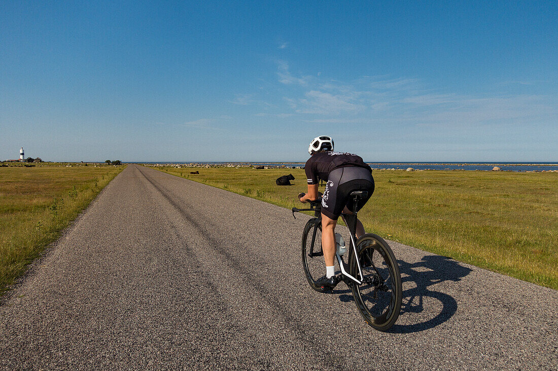 Man cycling on country road