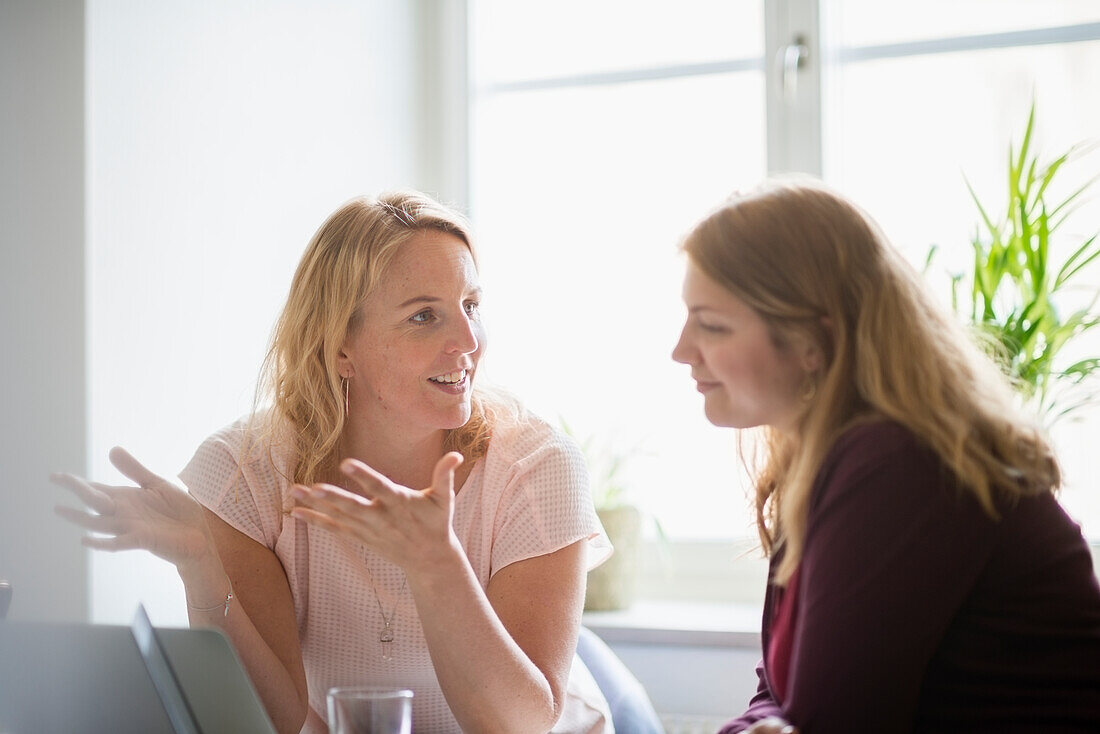 Two women working in office