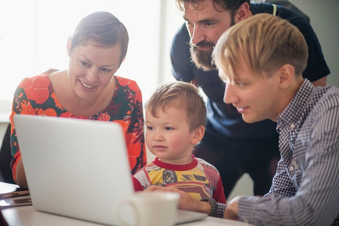 People during business meeting with small boy