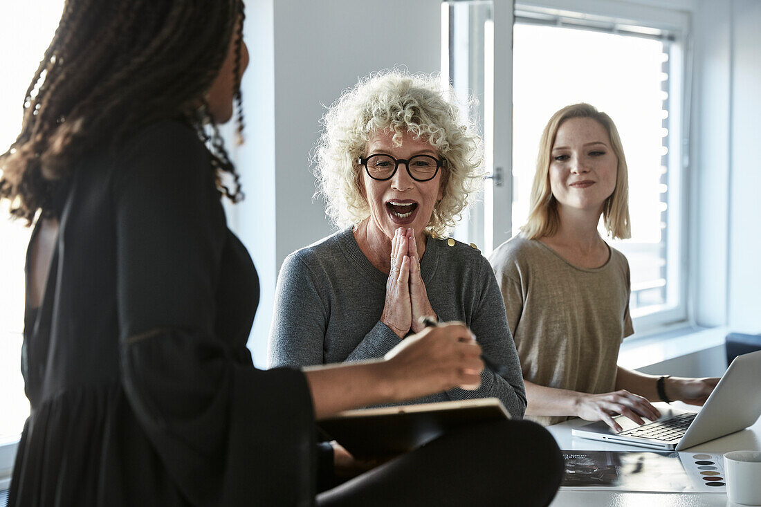 Smiling coworkers during meeting