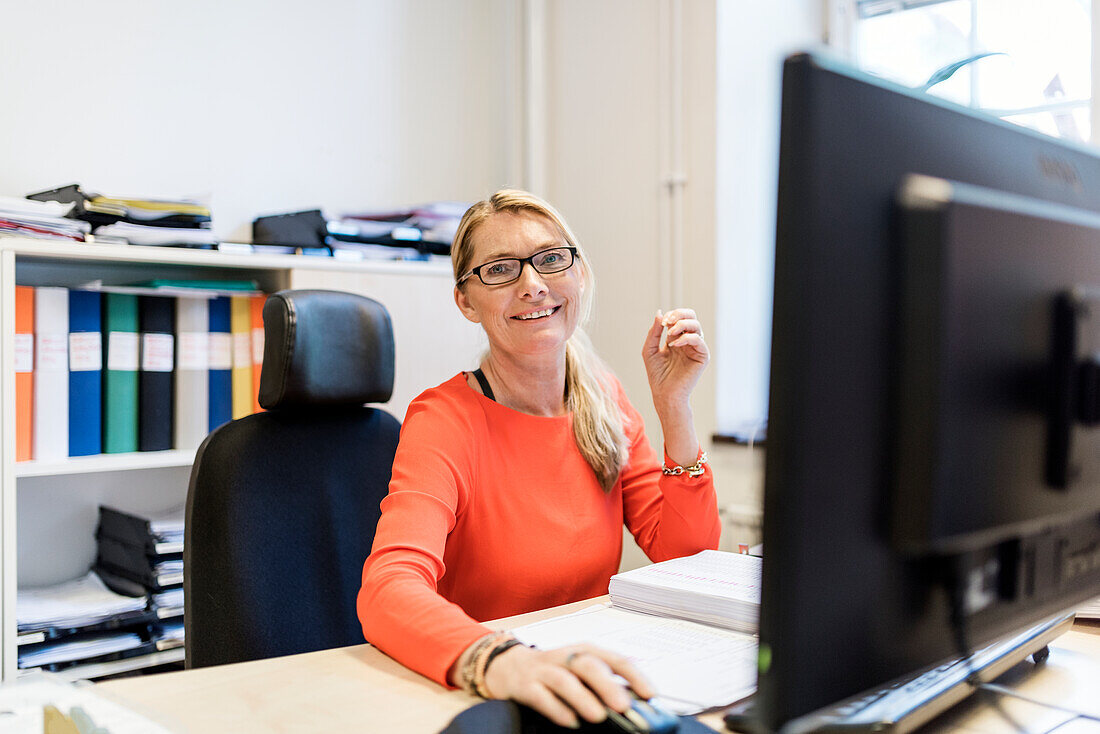 Blond woman working in office