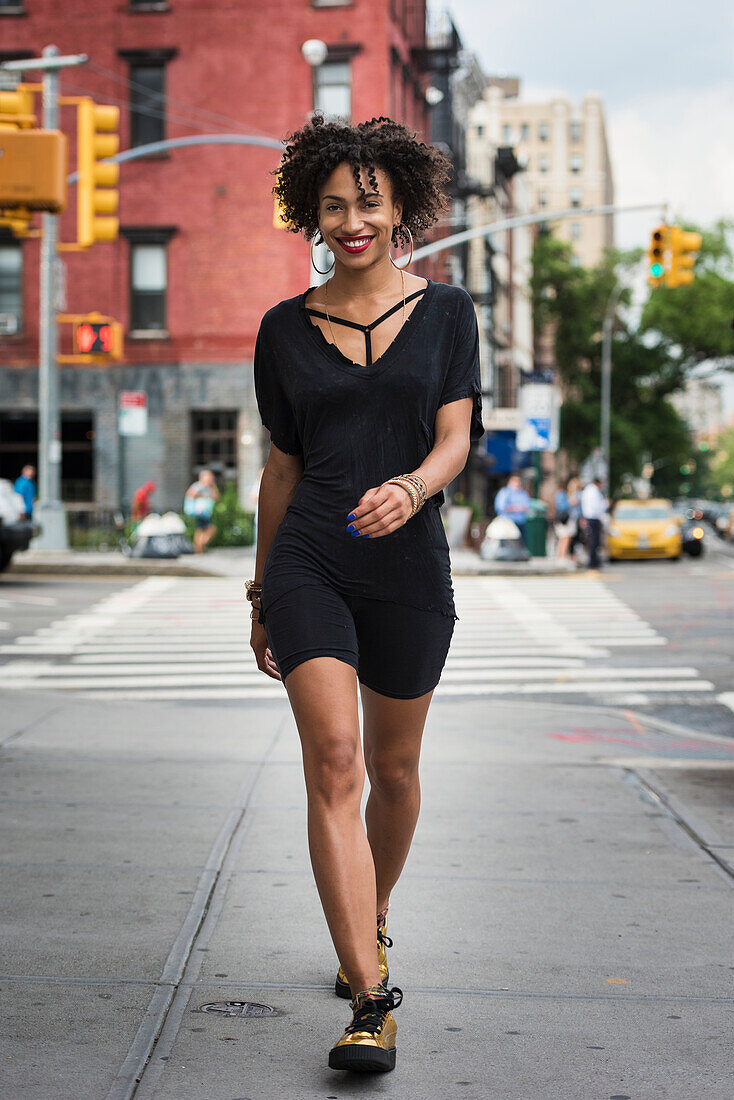 Stylish woman walking on street