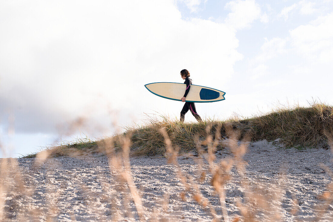 Female surfer with surfboard