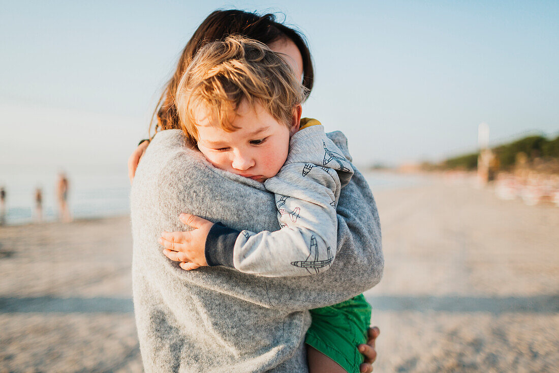 Mother and son hugging