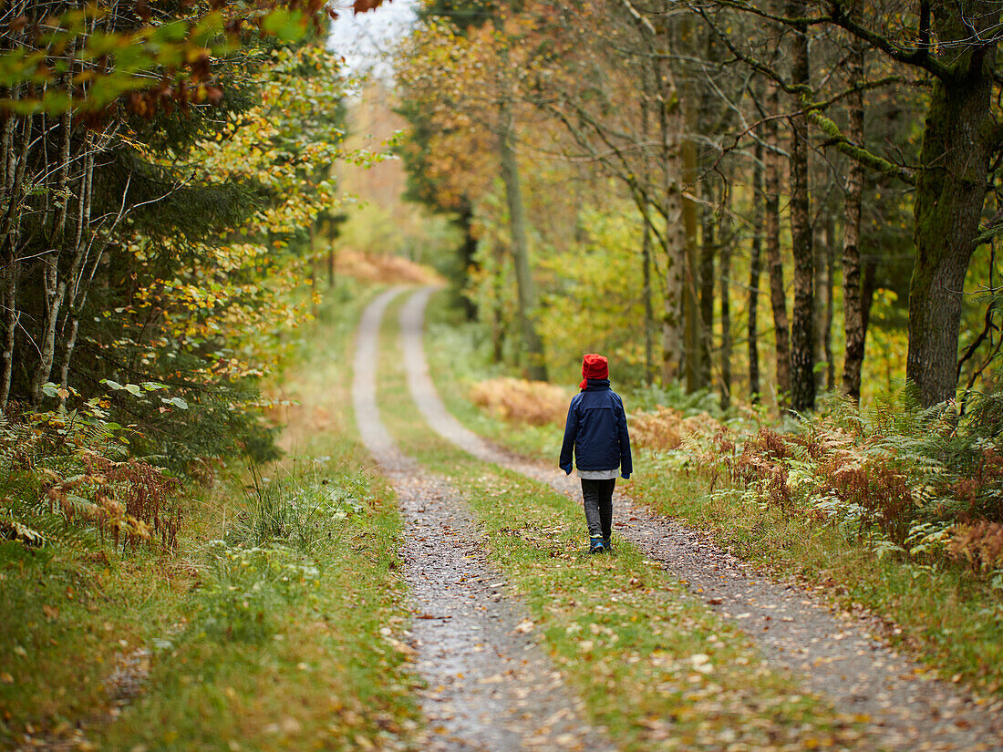 Girl walking in forest