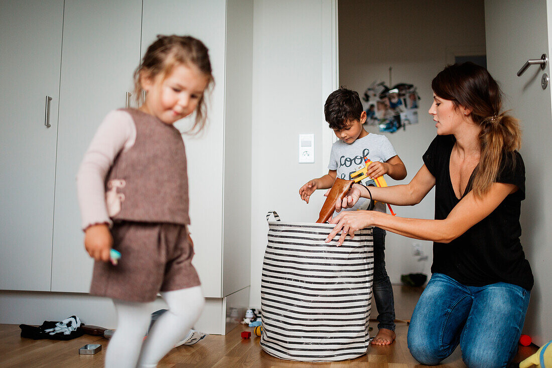 Mother and kids cleaning house