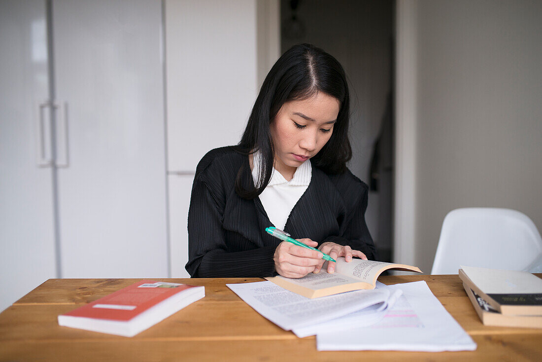 Young woman studying at home
