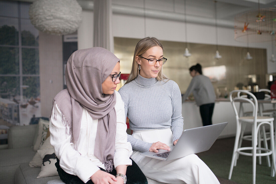 Two women working in office