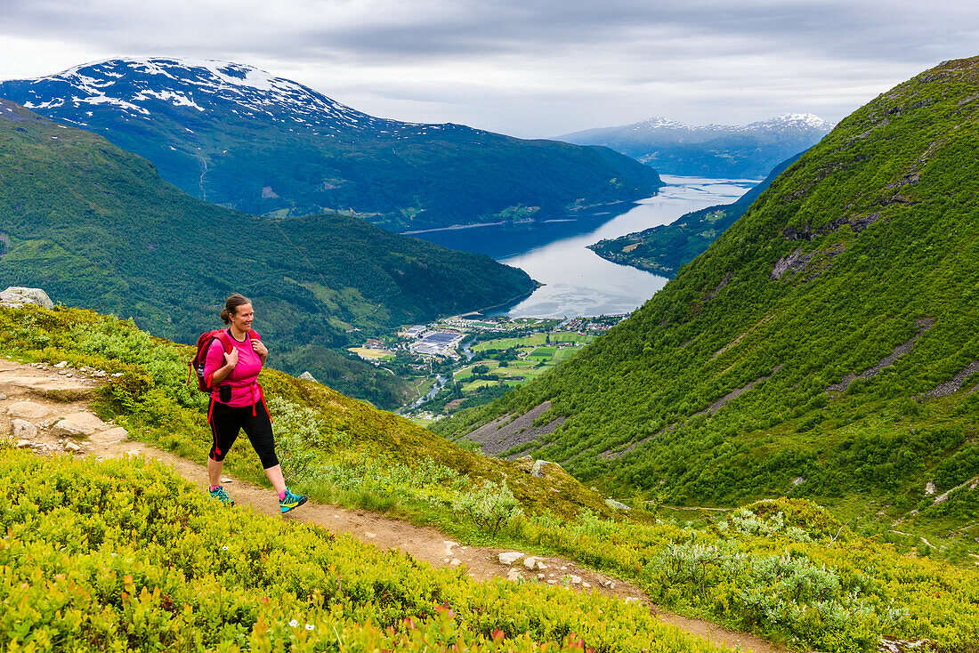 Woman walking in mountain landscape