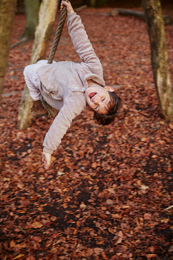 Happy girl swinging