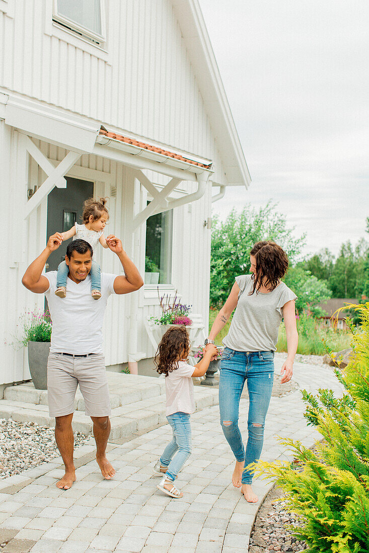 Family walking in garden