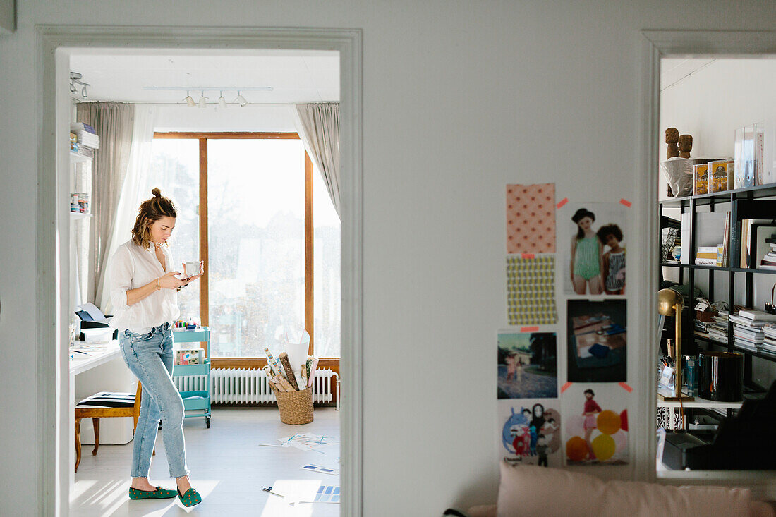 Woman standing in living room