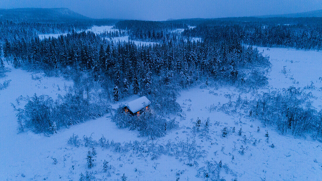 Small cottage in snow