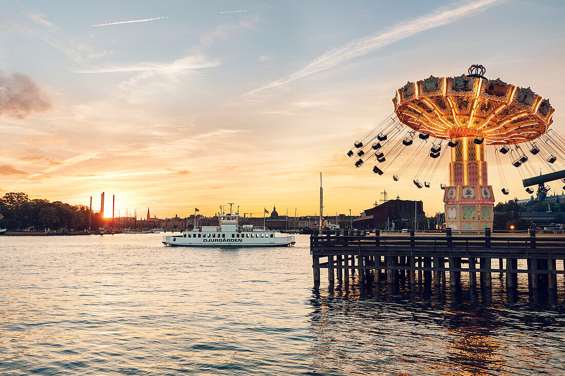 Illuminated amusement park at sea