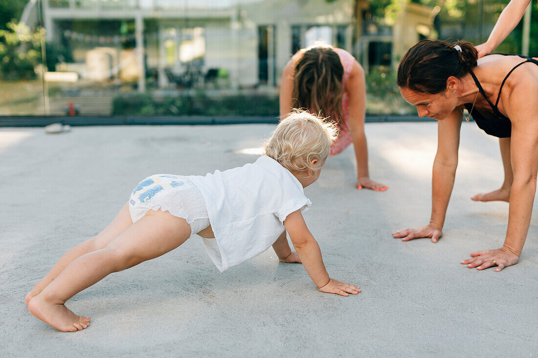 Mother with children exercising