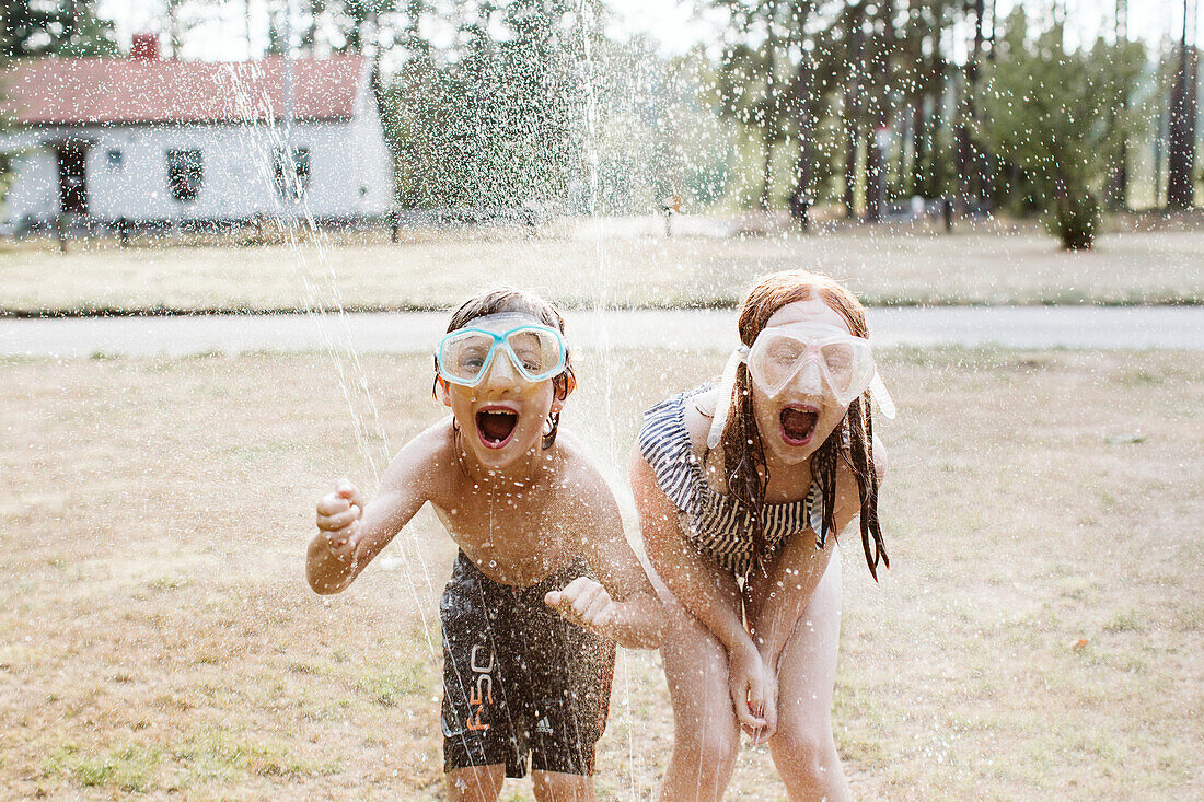 Cheerful kids wearing snorkel masks