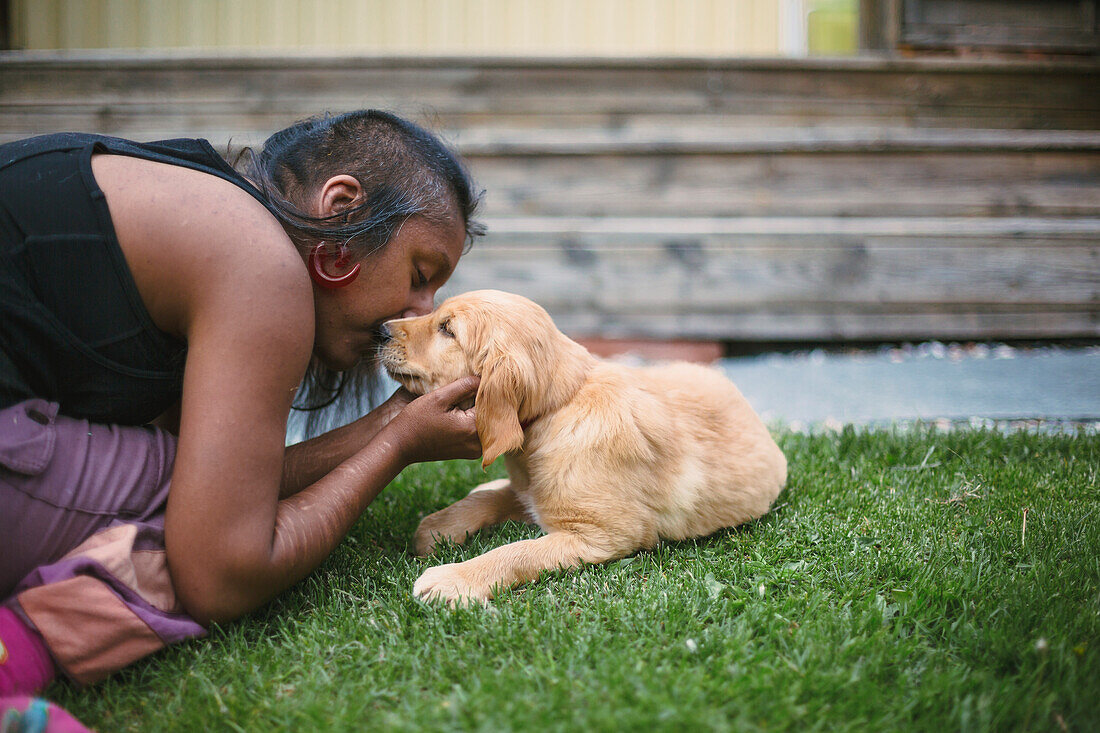 Woman playing with dog