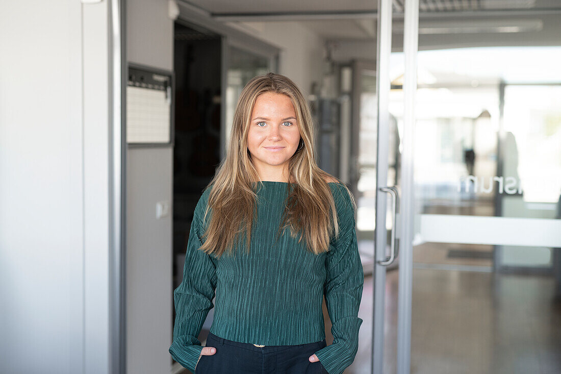 Smiling woman on corridor