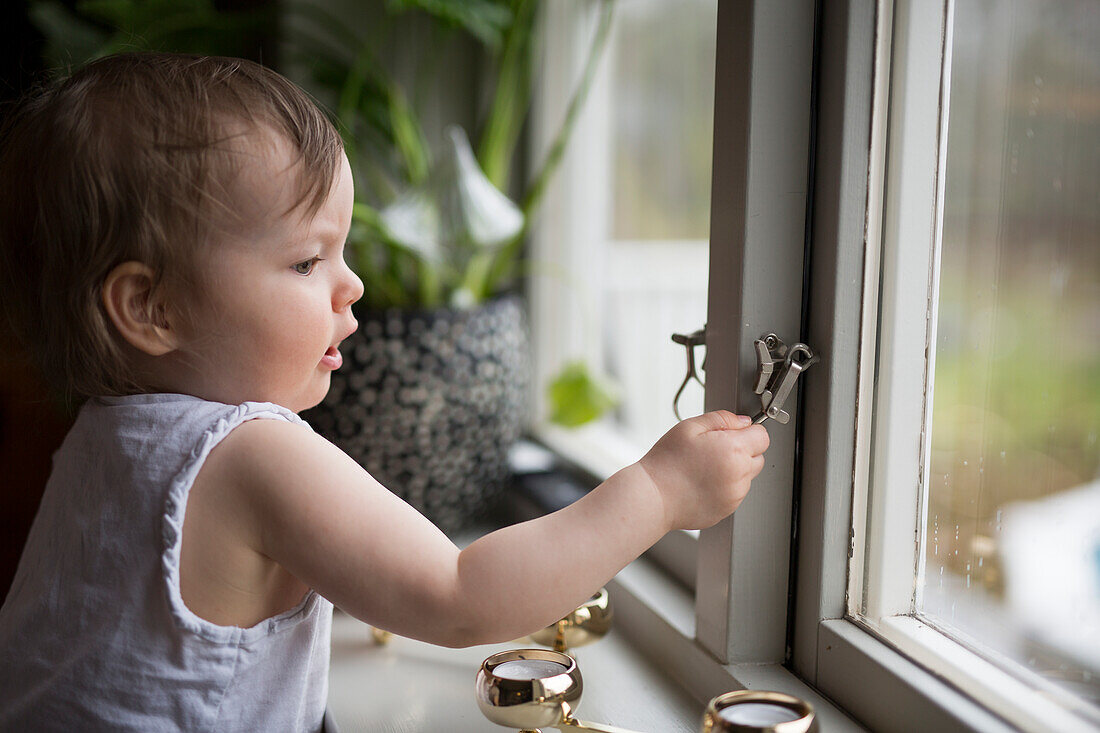 Boy looking out of window