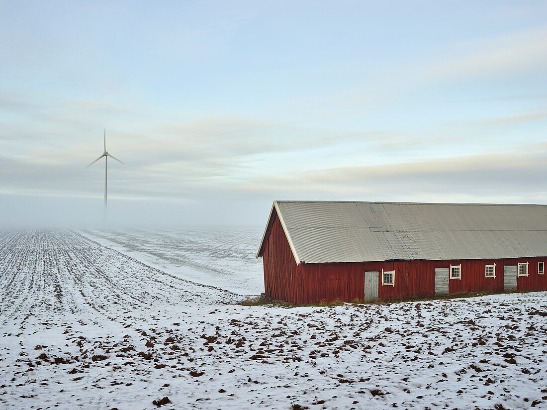 Barn on plowed field