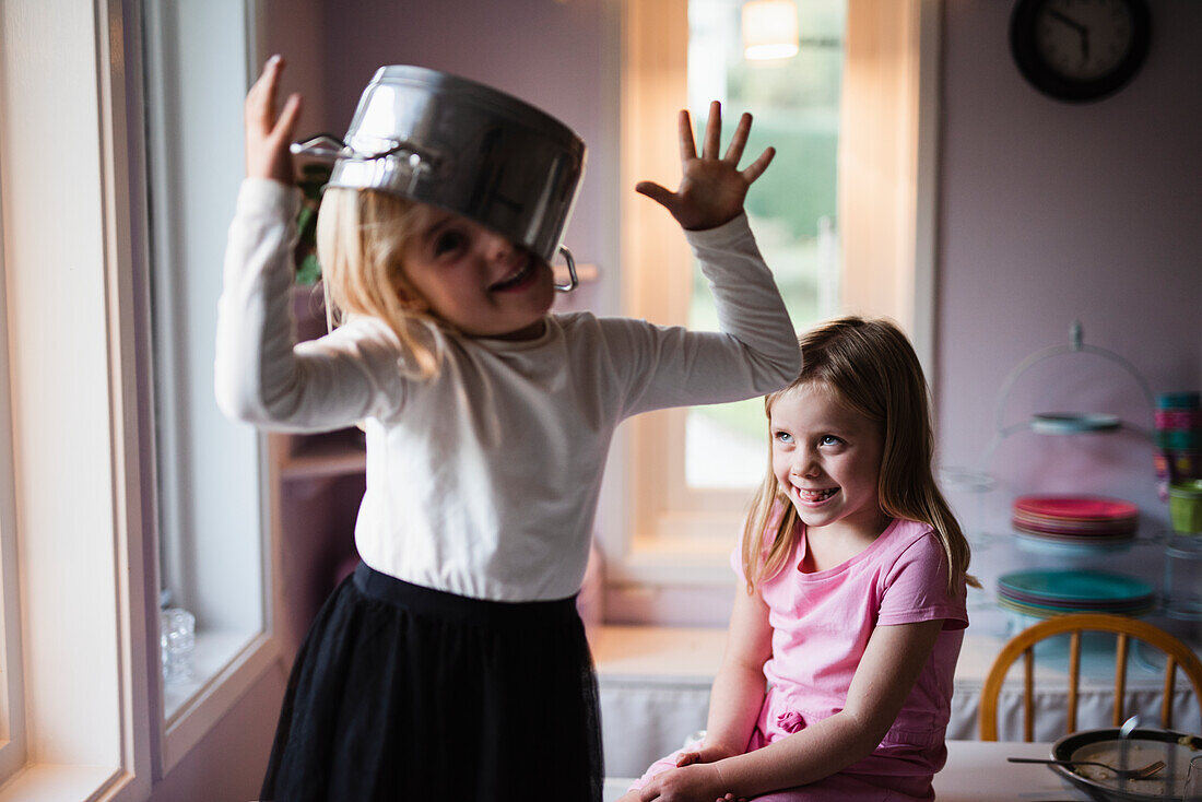 Girl wearing pot on head