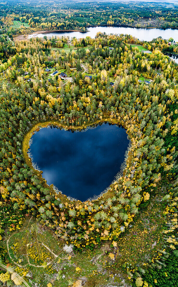 Heart-shaped lake surrounded by forest