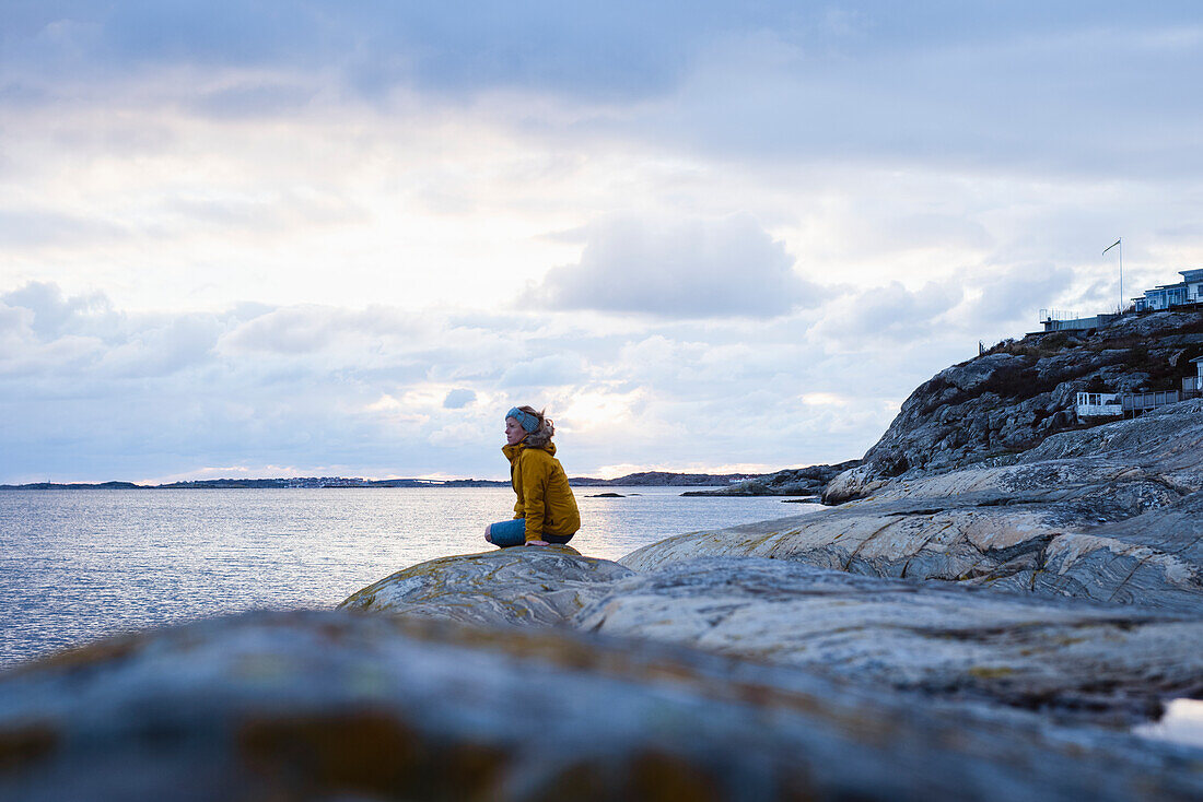 Woman on rocky coast