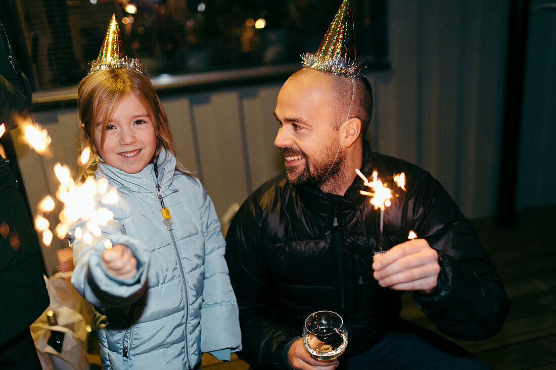 Girl with father at party