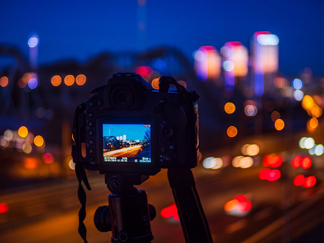 Camera with picture of busy road on screen