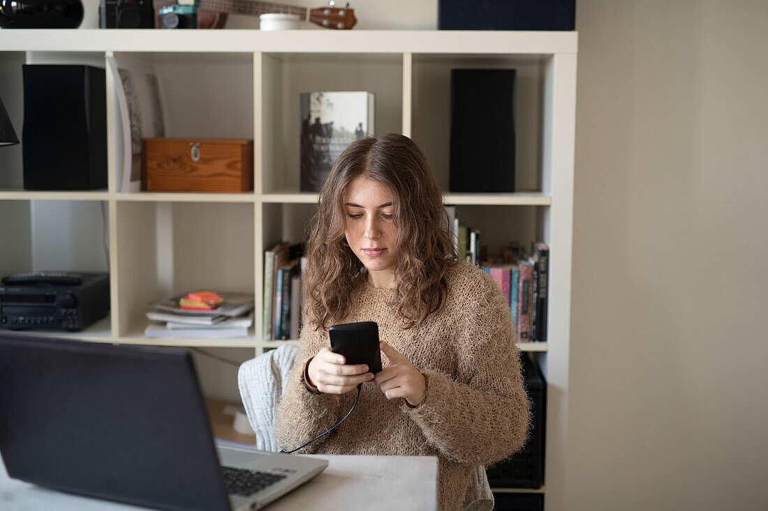 Young woman using cell phone