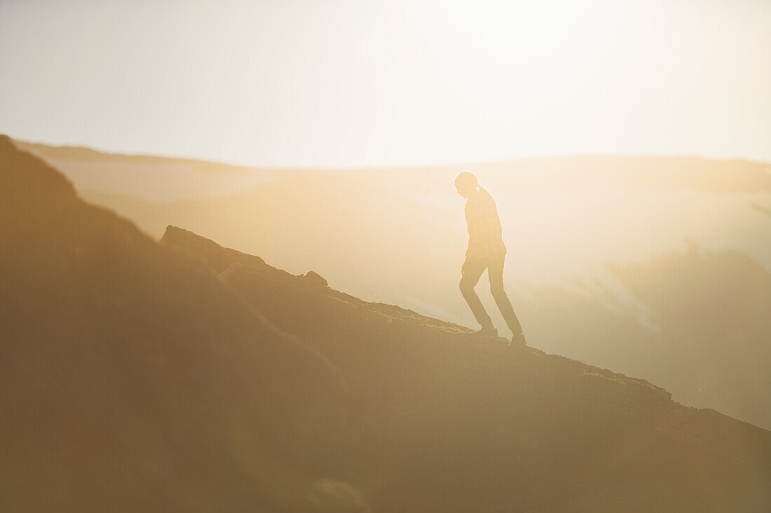 Girl climbing mountain