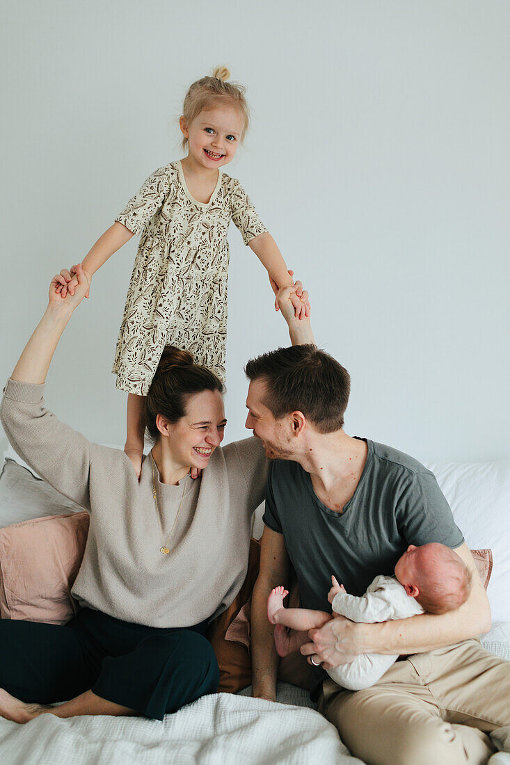 Family on bed