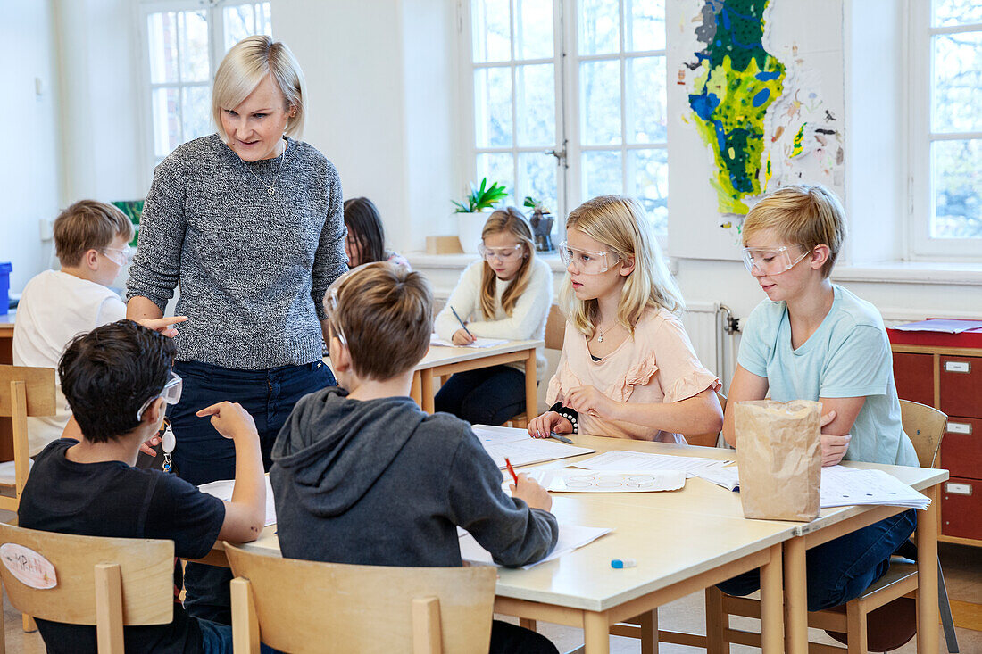 Schoolchildren with teacher in classroom