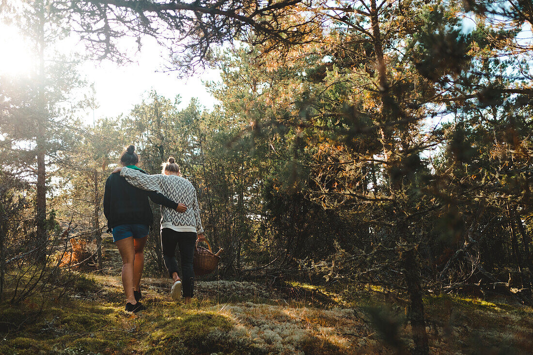 Women walking in forest