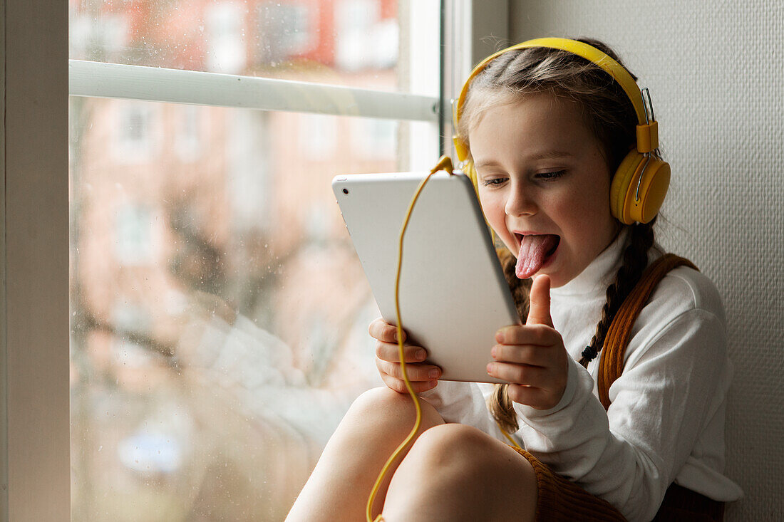 Girl using digital tablet