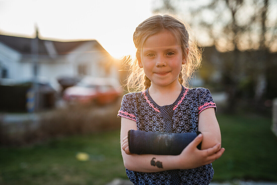 Girl with plastered arm