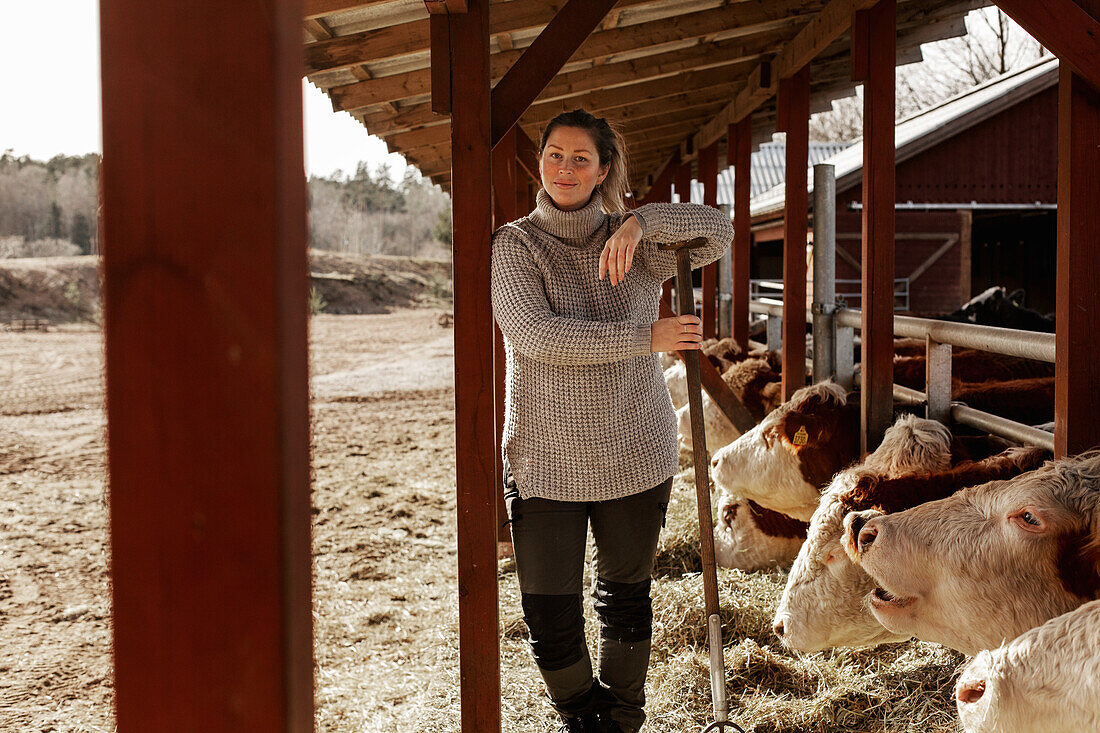 Woman in cowshed