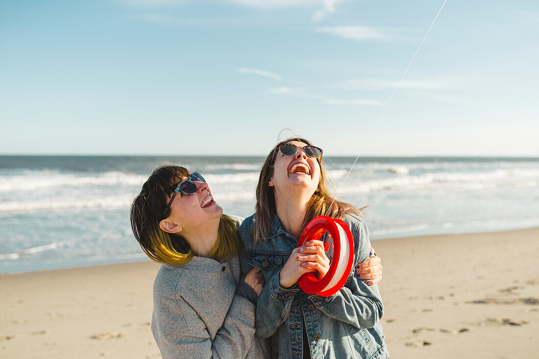 Happy friends on beach