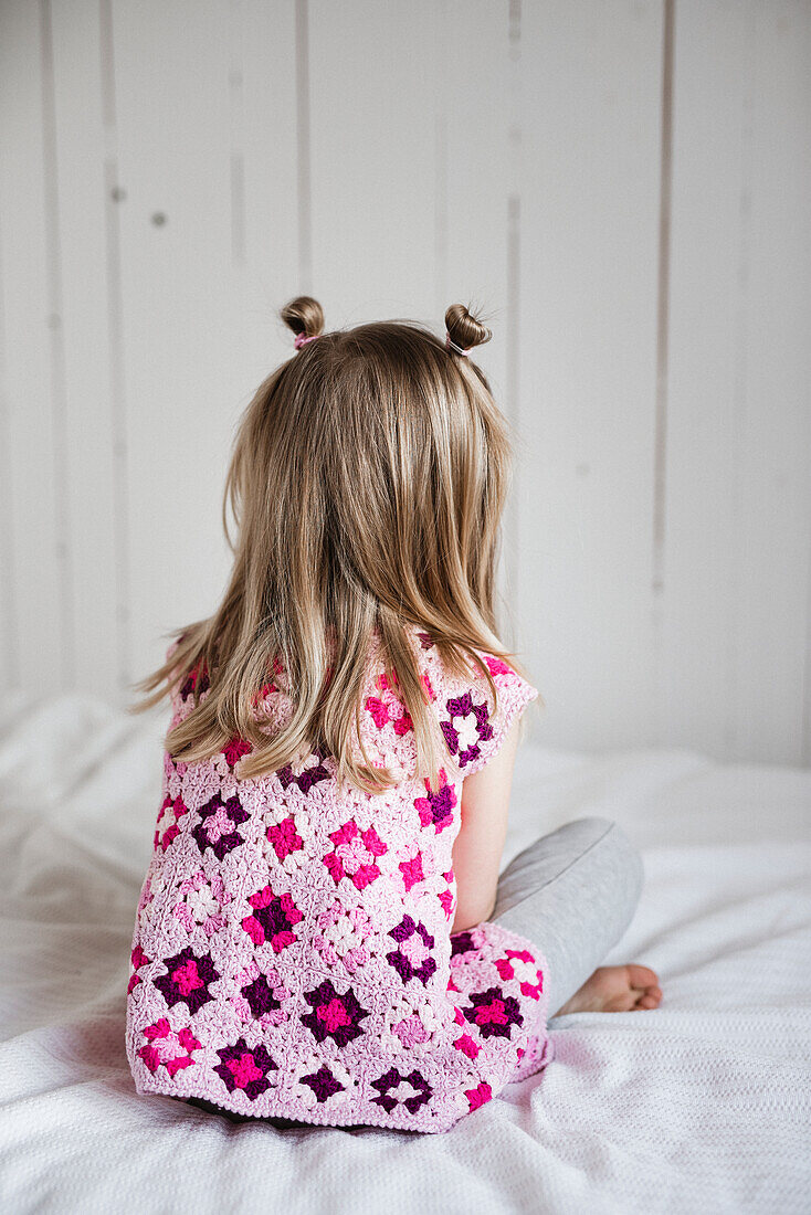 Girl sitting on bed