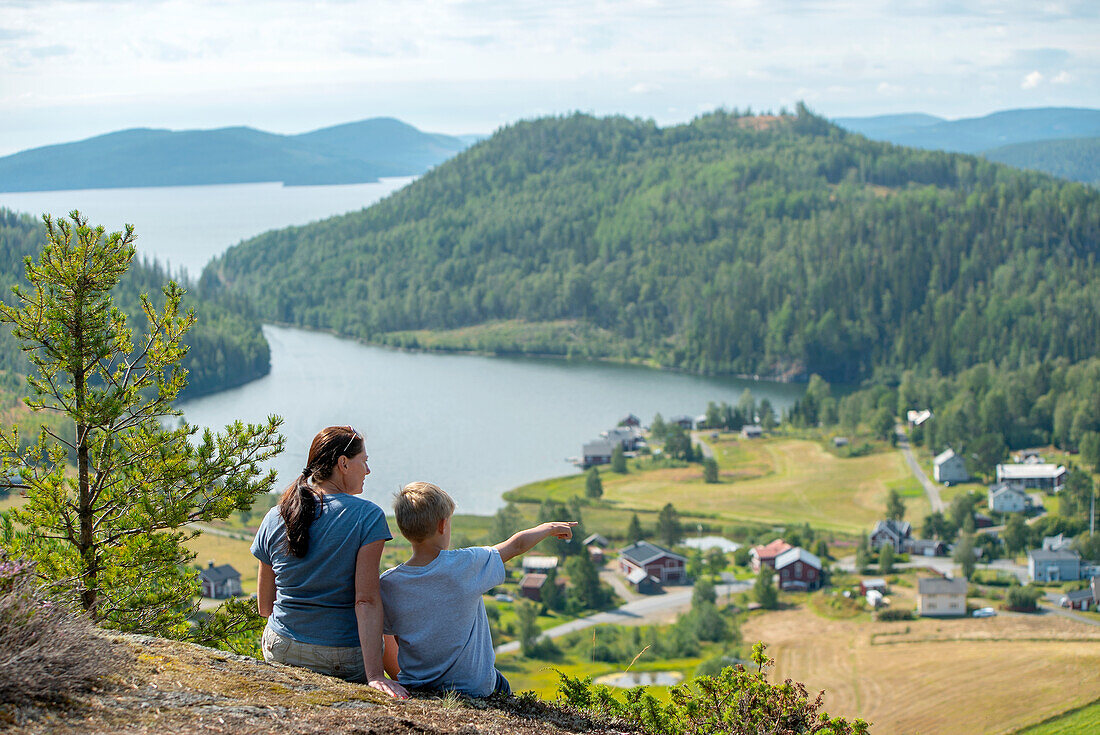 Mother and son looking at view