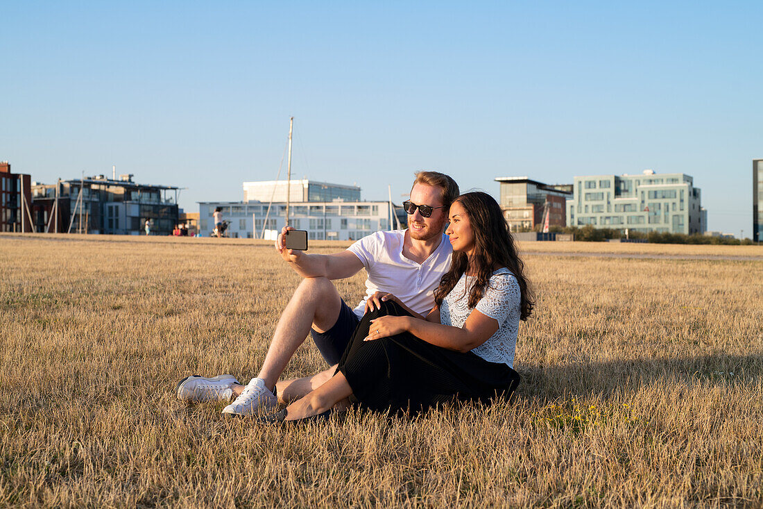 Young couple taking selfie