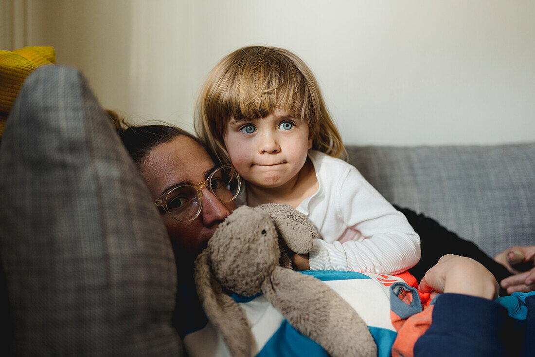 Mother with daughter on sofa