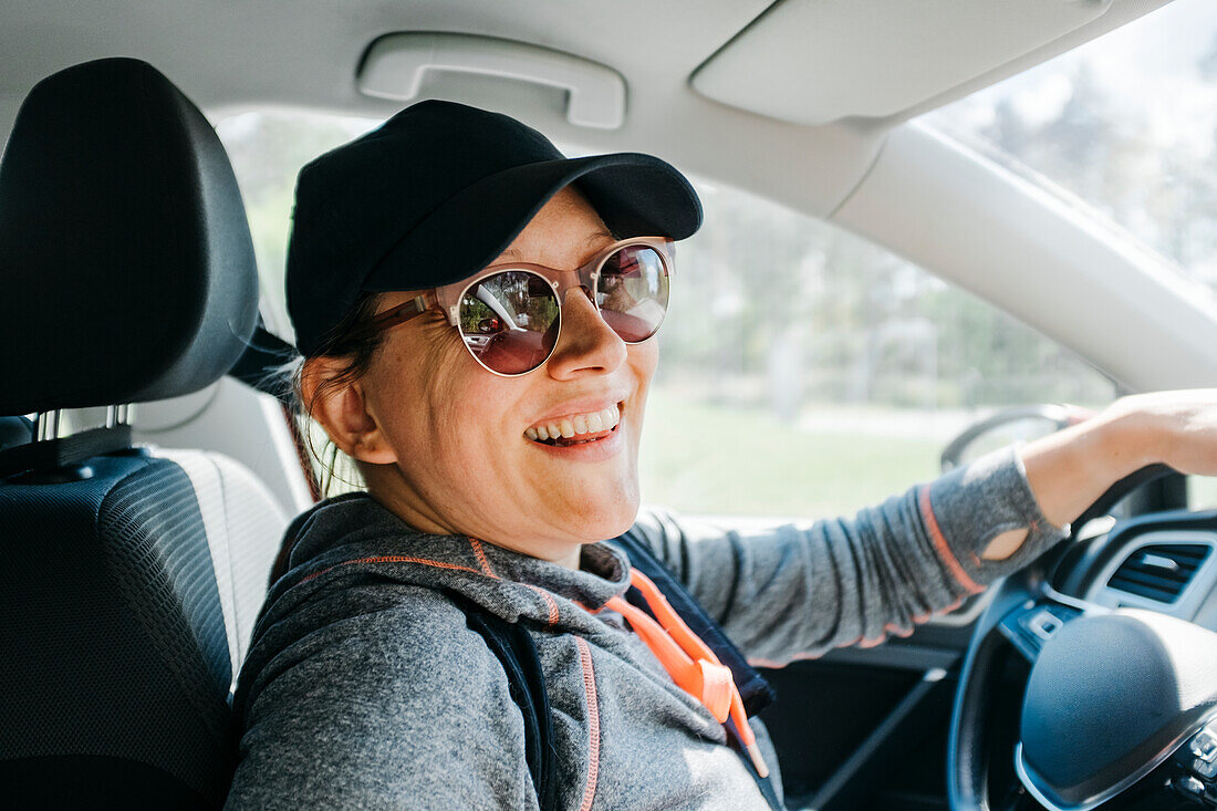 Smiling woman in car