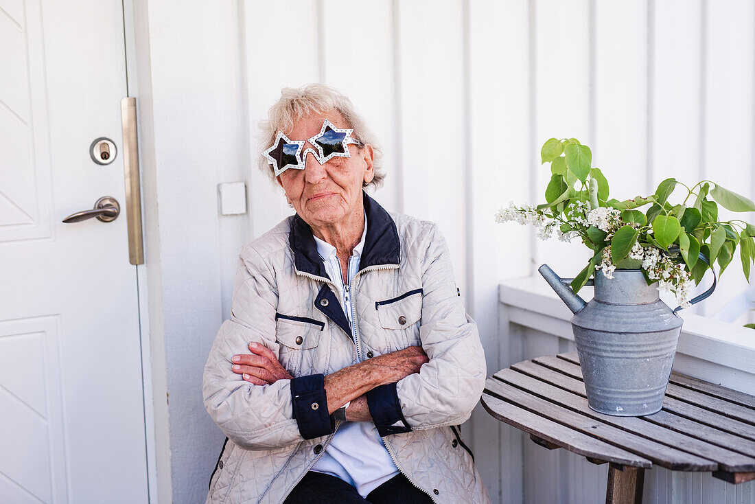 Woman wearing star-shaped sunglasses