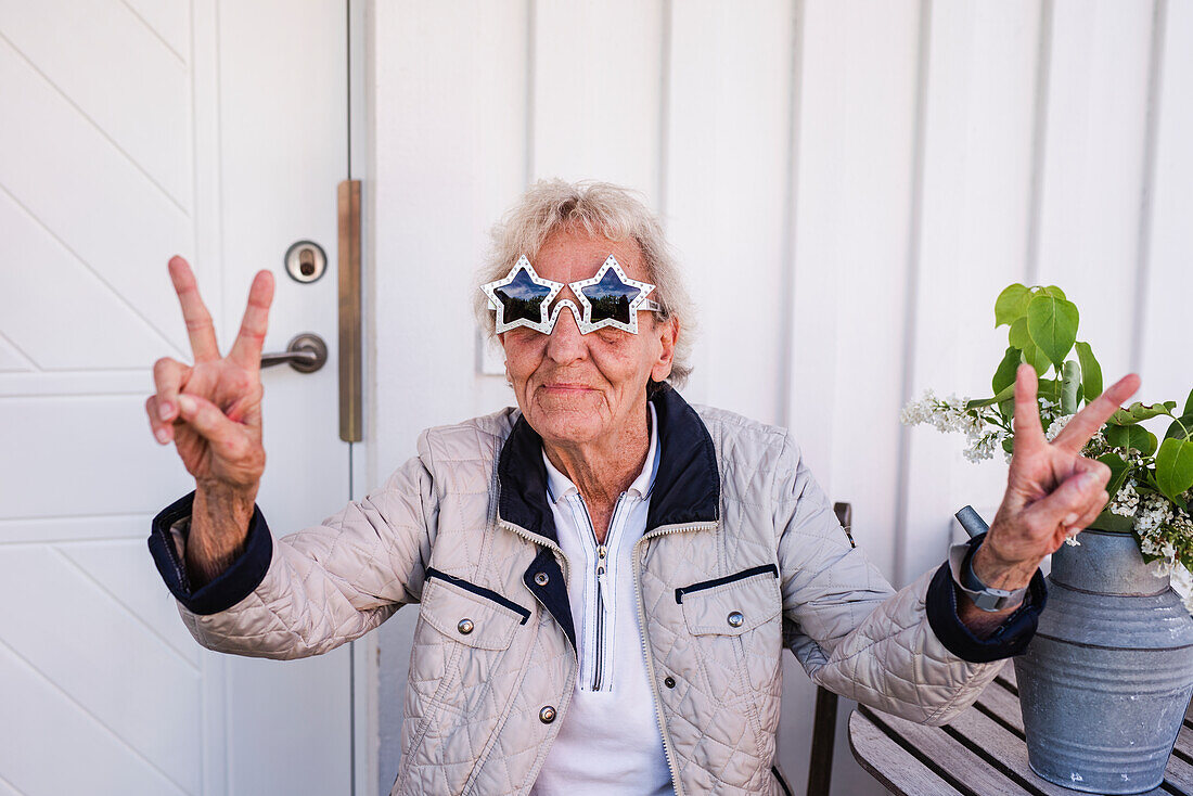 Woman wearing star-shaped sunglasses