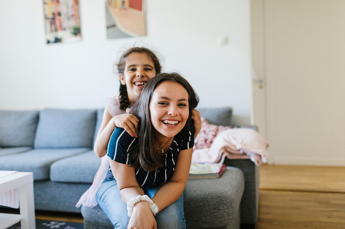 Smiling sisters together