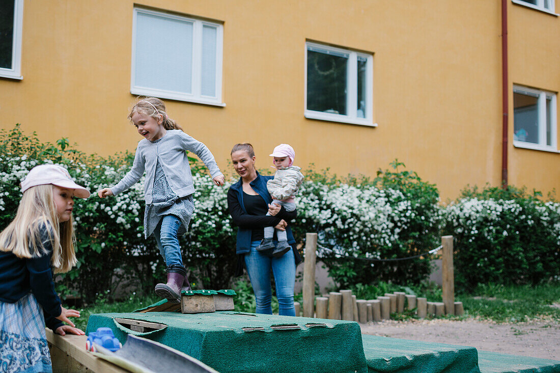 Mother with children outside