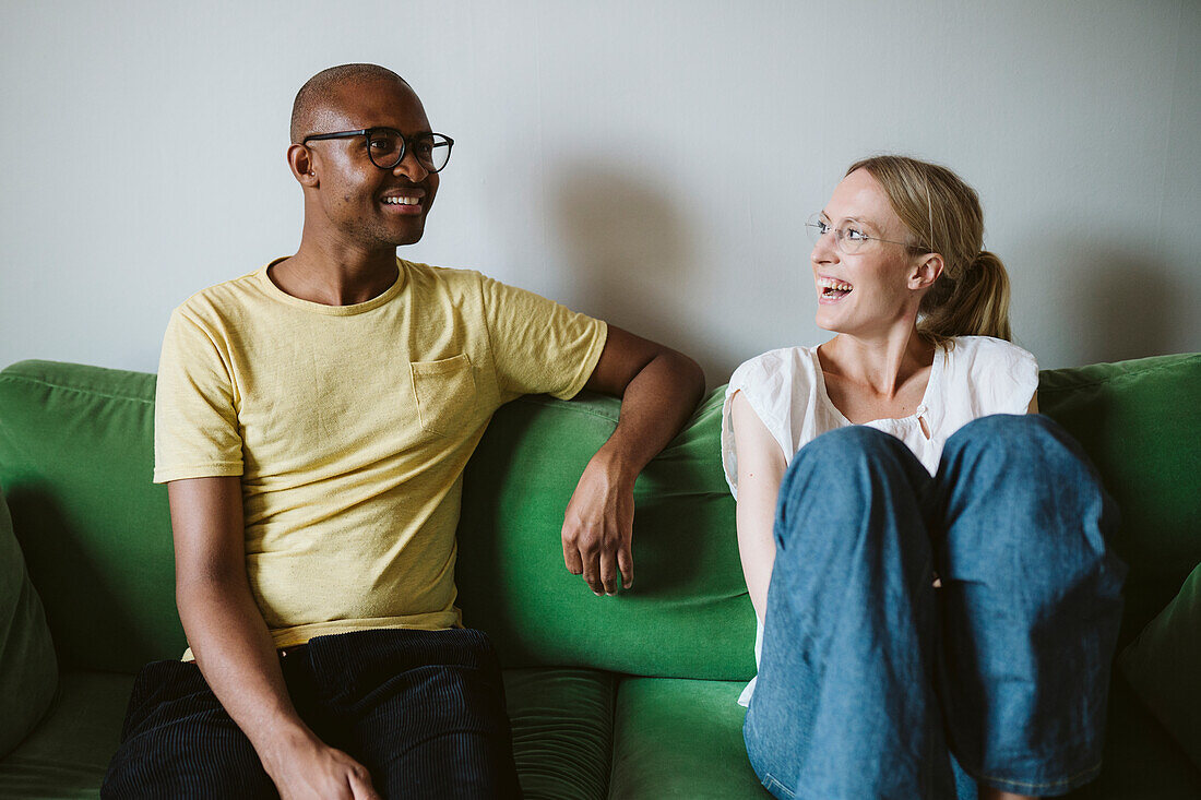 Couple sitting on sofa