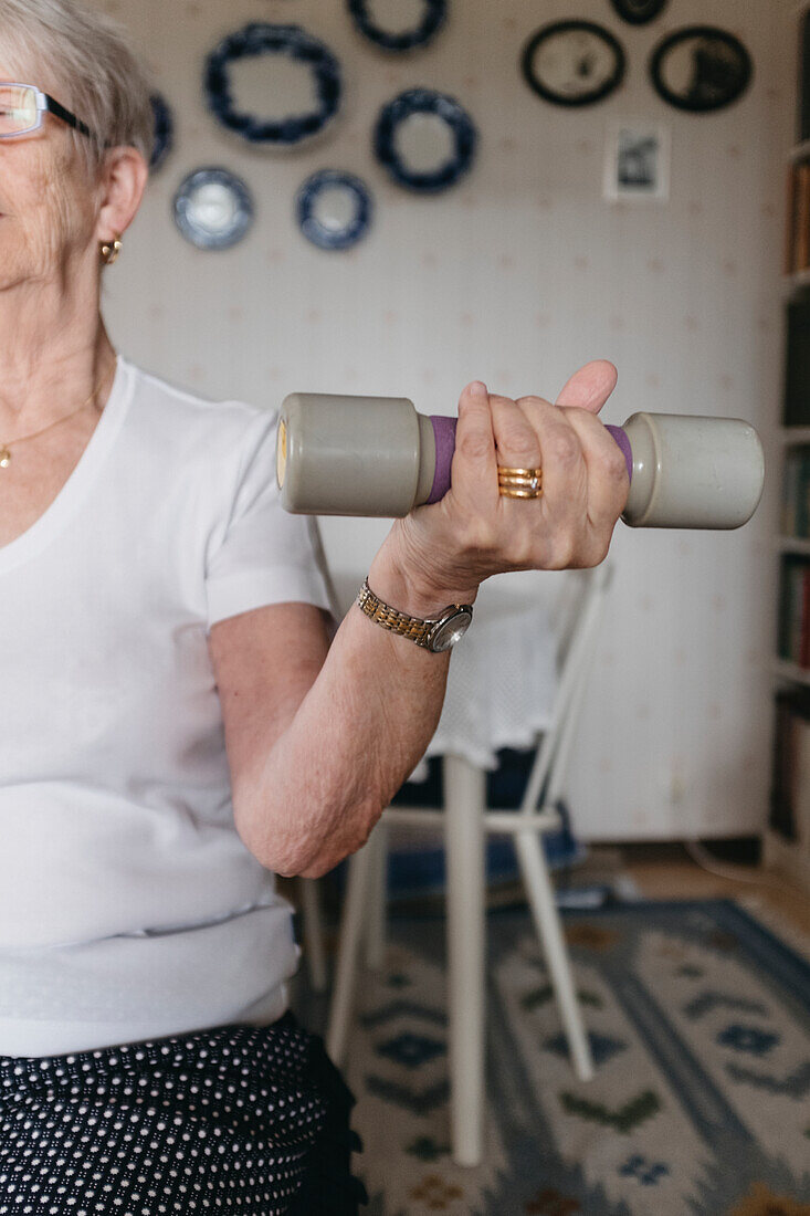 Woman training with dumbbell