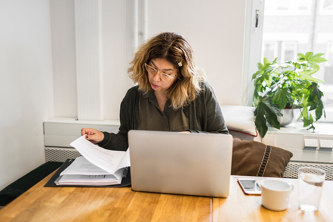 Woman looking at documents